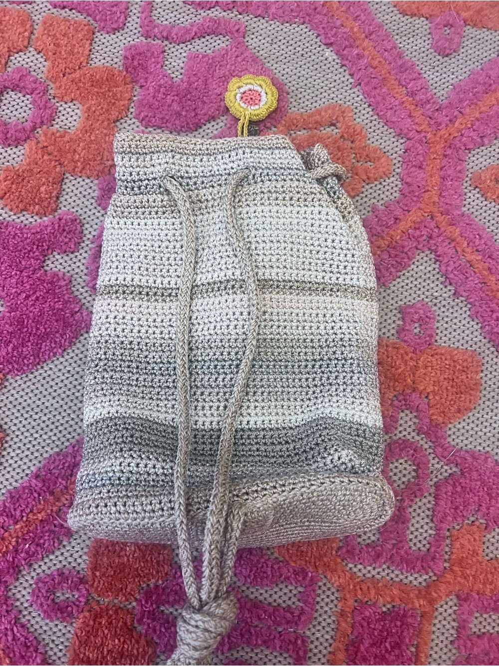The Sak Crochet Drawstring Bucket Bag in Beige and Gray